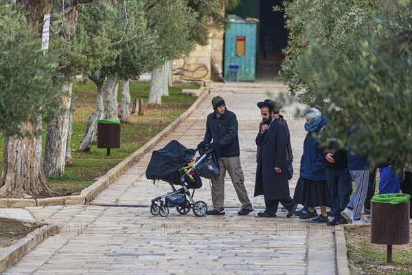 A group of Israeli Jews visiting the temple Mount despite official rabbinic ban on setting foot on the sacred site