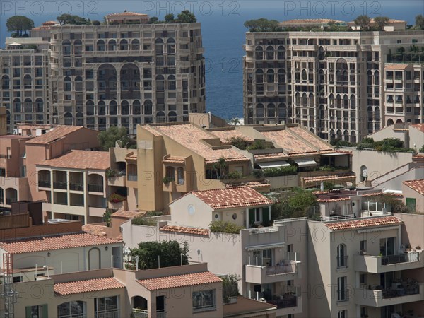 View of modern apartment building with Mediterranean architecture, sea in the background, monte carlo, monaco, france
