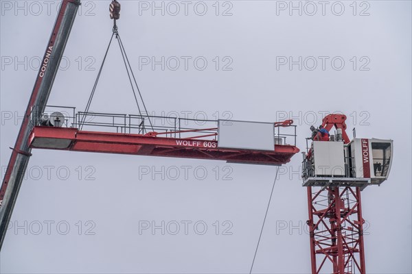 Dismantling of a large construction crane, on a large construction site, housing construction, shell construction is completed, Essen, North Rhine-Westphalia, Germany, Europe