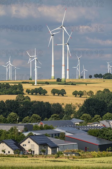 Wind farm near the East Westphalian town of Energiestadt Lichtenau, many residential and commercial buildings with photovoltaic systems on the roofs, over 80 wind turbines on this hill, in total there are more than 200 wind turbines around the town, producing 9 times more electricity than the town itself consumes, the rest is fed into the grid, North Rhine-Westphalia, Germany, Europe