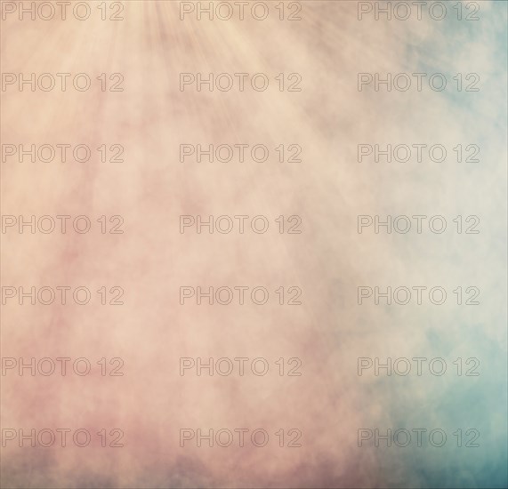 Pastel colored bokeh background with defocused round lights and sunbeams, flare overlay
