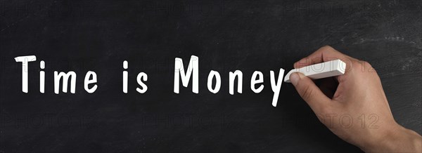 Time is money is standing on a chalkboard, finance knowledge and strategy, working for salery, business concept