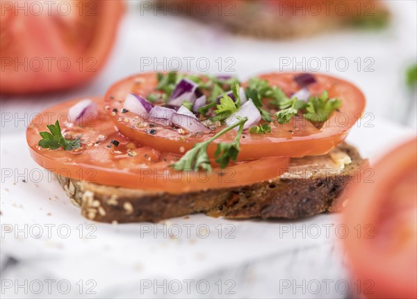 Portion of fresh Tomato Sandwich (selective focus, close-up shot)