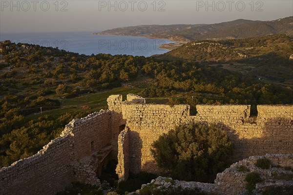View from a stone ruin of the coastal landscape at sunset, Kritinia Castle, St John's Castle, Kritinia, Rhodes, Dodecanese, Greek Islands, Greece, Europe
