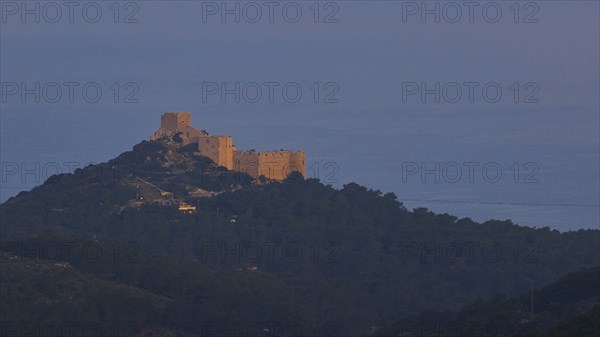 A castle on a hill in the first morning light, surrounded by natural landscape, Kritinia Castle, St John's Castle, Kritinia, Rhodes, Dodecanese, Greek Islands, Greece, Europe