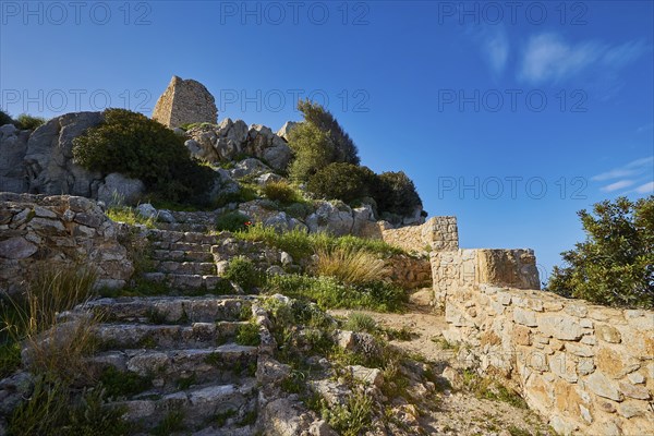 Stone steps lead to the ruins of an ancient castle, surrounded by nature under a blue sky, Kritinia Castle, St John's Castle, Kritinia, Rhodes, Dodecanese, Greek Islands, Greece, Europe