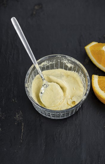 Fresh made Orange fruit Powder as detailed close-up shot (selective focus)