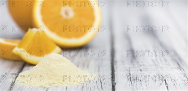 Fresh made Orange fruit Powder as detailed close-up shot (selective focus)