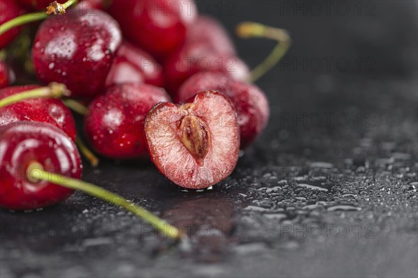 Some Cherries on a slate slab as detailed close-up shot, selective focus