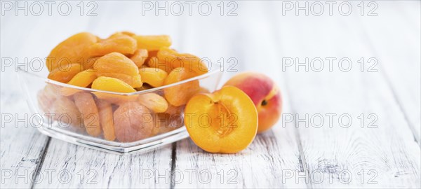 Dried Apricots on a vintage background as detailed close-up shot (selective focus)