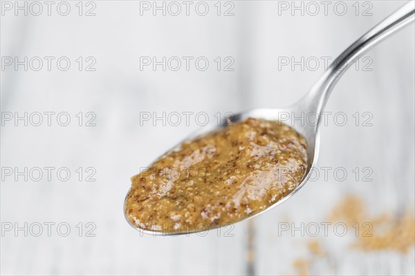 Sweet Mustard on a vintage background as detailed close-up shot (selective focus)