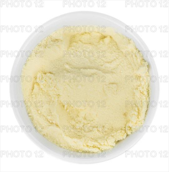 Portion of fresh made Orange Powder as detailed close-up shot isolated on white background