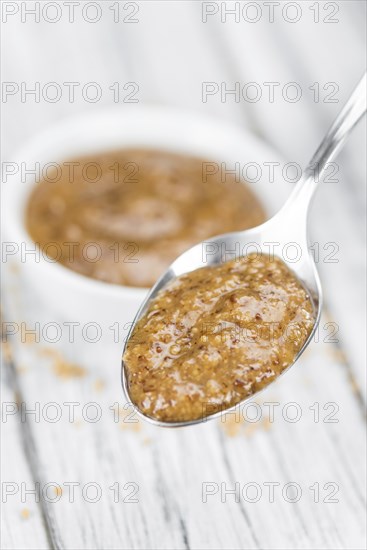 Sweet Mustard on a vintage background as detailed close-up shot (selective focus)