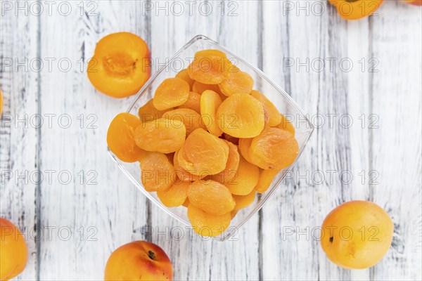 Dried Apricots on a vintage background as detailed close-up shot (selective focus)