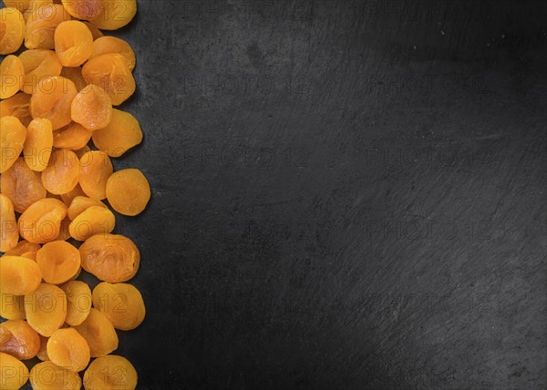 Portion of fresh Dried Apricots (close-up shot, selective focus)
