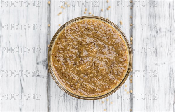 Sweet Mustard on a vintage background as detailed close-up shot (selective focus)