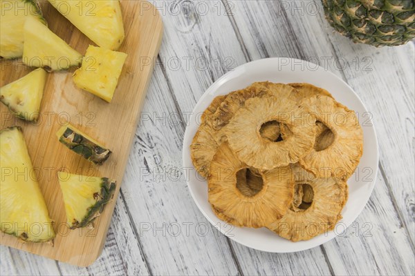 Some homemade Dried Pineapple Rings as detailed close-up shot, selective focus
