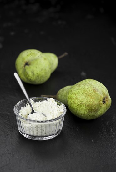 Fresh made Pear powder on a slate slab (close-up shot, selective focus)