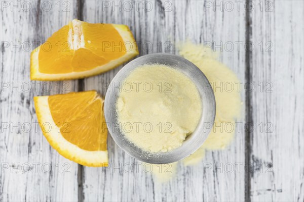 Portion of fresh made Orange Powder as detailed close-up shot (selective focus)