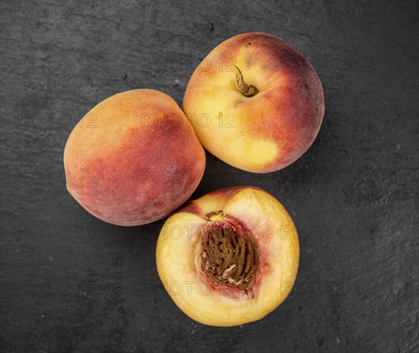 Portion of fresh Peaches close-up shot, selective focus