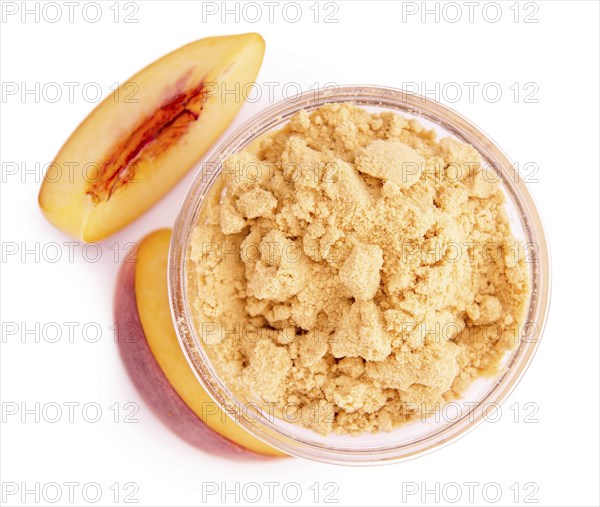 Fresh made Ground Peaches isolated on white background, close-up shot