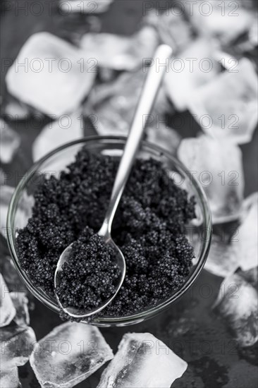 Portion of fresh Black Caviar (selective focus, close-up shot)