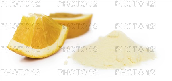 Portion of fresh made Orange Powder as detailed close-up shot isolated on white background