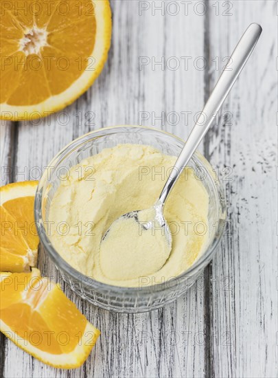 Portion of fresh made Orange Powder as detailed close-up shot (selective focus)