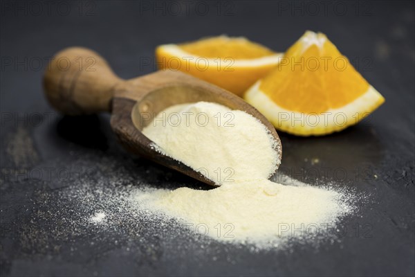 Fresh made Orange fruit Powder as detailed close-up shot (selective focus)