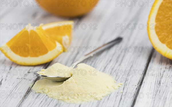 Fresh made Orange fruit Powder as detailed close-up shot (selective focus)