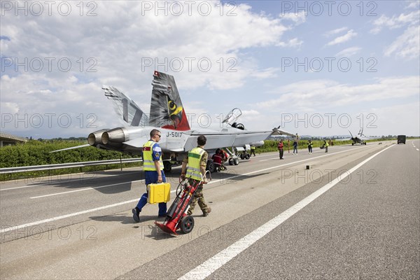 Swiss Air Force F/A 18 fighter aircraft take off and land on the A1 motorway during the Alpha Uno exercise in Payerne on Wednesday, 5 June 2024. The purpose of the military exercise is to strengthen the defence capability of the Swiss Armed Forces through so-called decentralisation. (DDPS/DDPS, Philipp Schmidli)