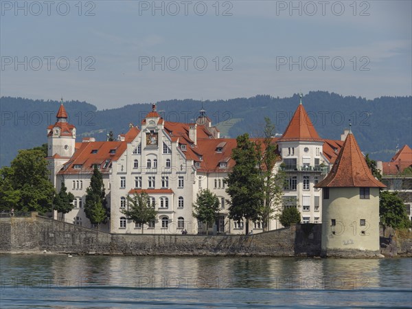 Close-up of a castle with red roofs and white walls on the lake, Lindau, Lake Constance, Germany, Europe