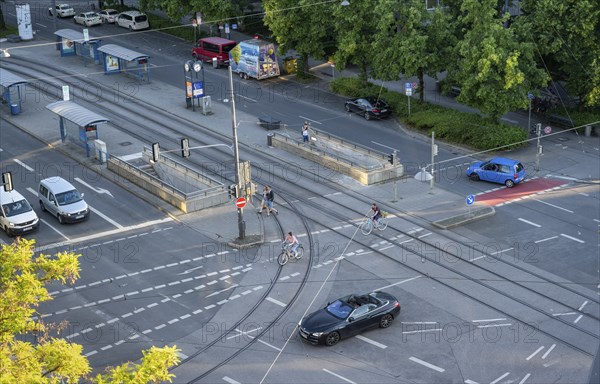 View from above of a road junction with tram stop, cyclists and cars crossing the junction, Stiglmaierplatz, Munich, Upper Bavaria, Bavaria, Germany, Europe