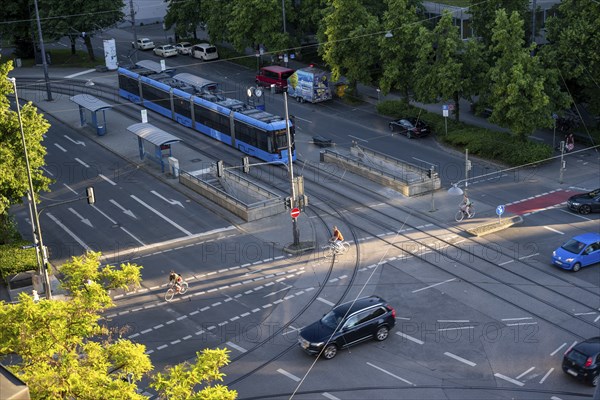 View from above of a road junction with tram and tram stop, cyclists and cars crossing the junction, Stiglmaierplatz, Munich, Upper Bavaria, Bavaria, Germany, Europe
