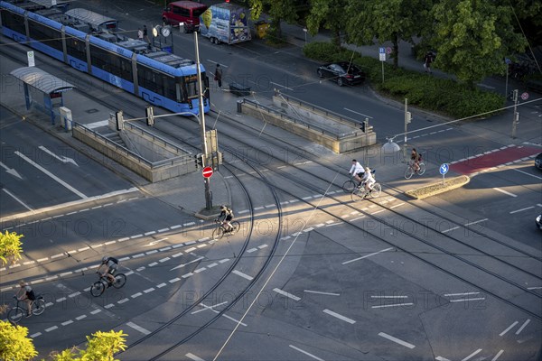 View from above of a road junction with tram and tram stop, cyclists crossing the junction, Stiglmaierplatz, Munich, Upper Bavaria, Bavaria, Germany, Europe
