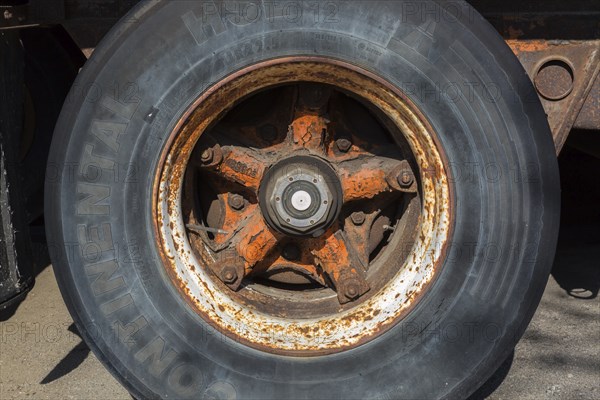 Close-up of Continental HSL tire with rusted metal rim on transportation truck, Quebec, Canada, North America