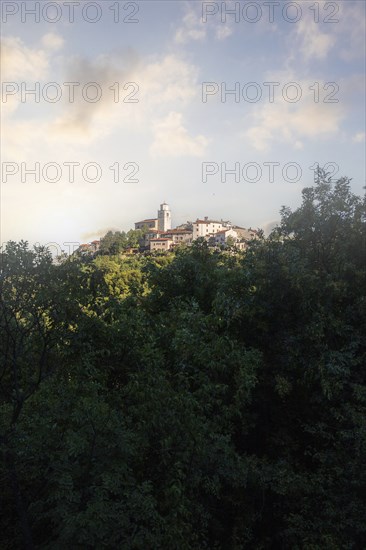 Fantastic sunset on a mountain. Great panorama of a mountain village on the Mediterranean. Beautiful Mediterranean landscape. You are looking at the town of Moscenice, Istria, Croatia, Europe