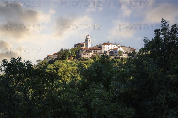 Fantastic sunset on a mountain. Great panorama of a mountain village on the Mediterranean. Beautiful Mediterranean landscape. You are looking at the town of Moscenice, Istria, Croatia, Europe