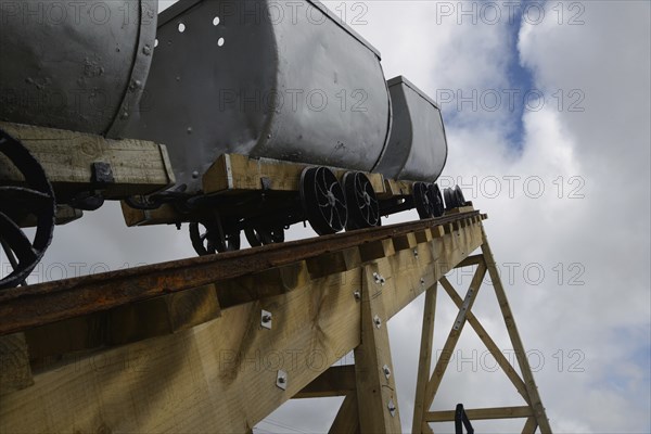 A coal mining memorial at Dobson in New Zealand features vintage coal wagons from an underground mine