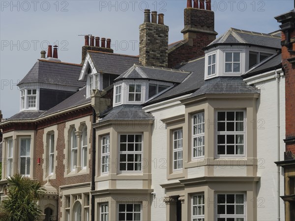 Terraced houses with large windows and tiled roofs in an urban environment, tynemouth, England, United Kingdom, Europe