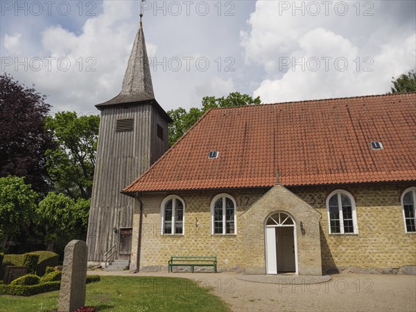 Historic church with a high tower and a red tiled roof against a sky, Arnis, Schleswig-Holstein, Germany, Europe