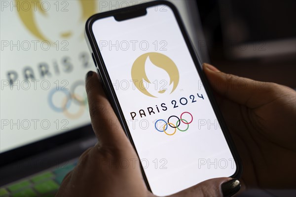 In this photo illustration, Paris 2024 olympic logo displayed on a smart phone