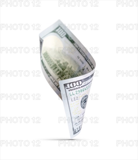 One hundred dollar bill floating down to surface with drop shadow isolated on a white background