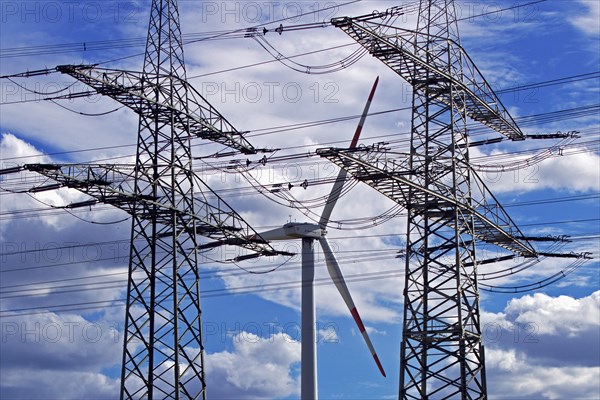 Two overhead line pylons and a wind turbine, Witten, Ruhr area, North Rhine-Westphalia, Germany, Europe
