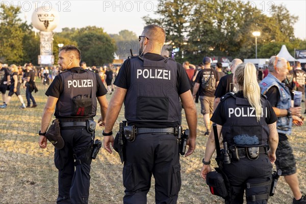 Police officers at the Wacken Open Air in Wacken. The traditional metal festival will take place from 31 July to 2 August 2024