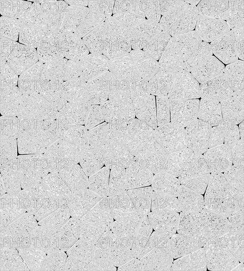Abstract stone texture resembling a gray mosaic with rough surface and irregular geometric patterns