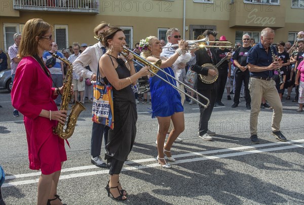 Jazz musicians, The Carling family, play on the street in Ystad in the opening of the Ystad Jazz Festival 2024, Skane County, Sweden, Scandinavia, Europe