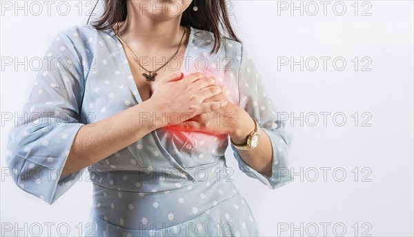 Unrecognizable woman with chest pain isolated. Girl with heart pain on isolated background. Concept of people with heart problems