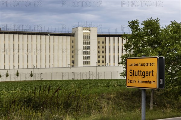 Stammheim Prison, JVA, exterior view of the maximum security prison with prison wall, Stammheim town sign, Stuttgart, Baden-Württemberg, Germany, Europe