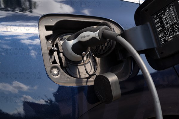 Mercedes-Benz E-Taxi at charging station EnBW for electric cars, electric charging station, e-filling station, e-mobility, charging cable leads in e-car, Stuttgart, Baden-Württemberg, Germany, Europe